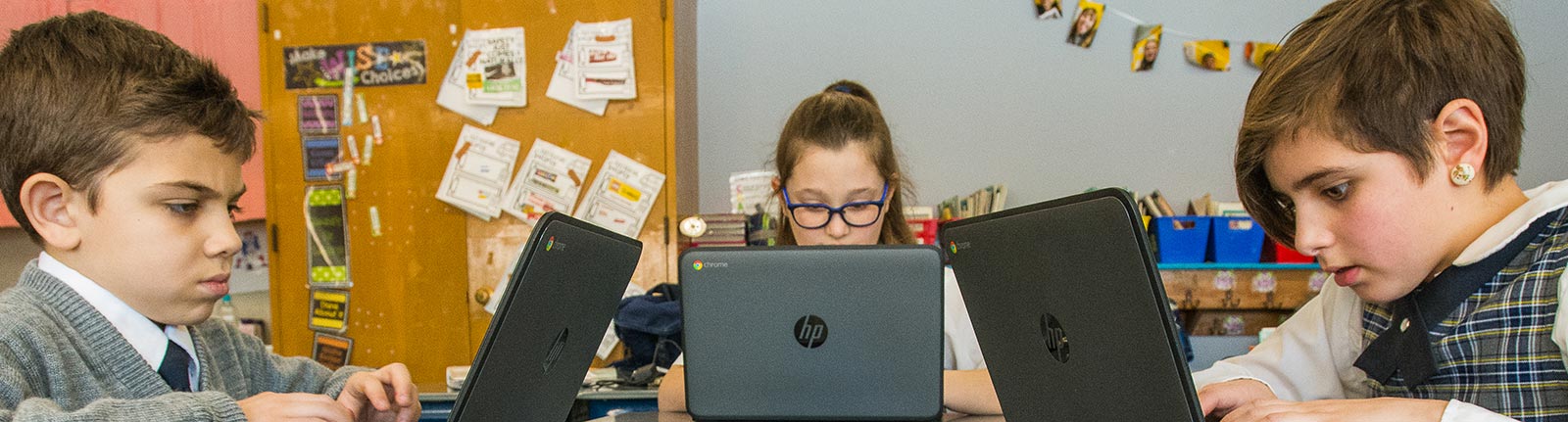 Three Students on Chromebooks